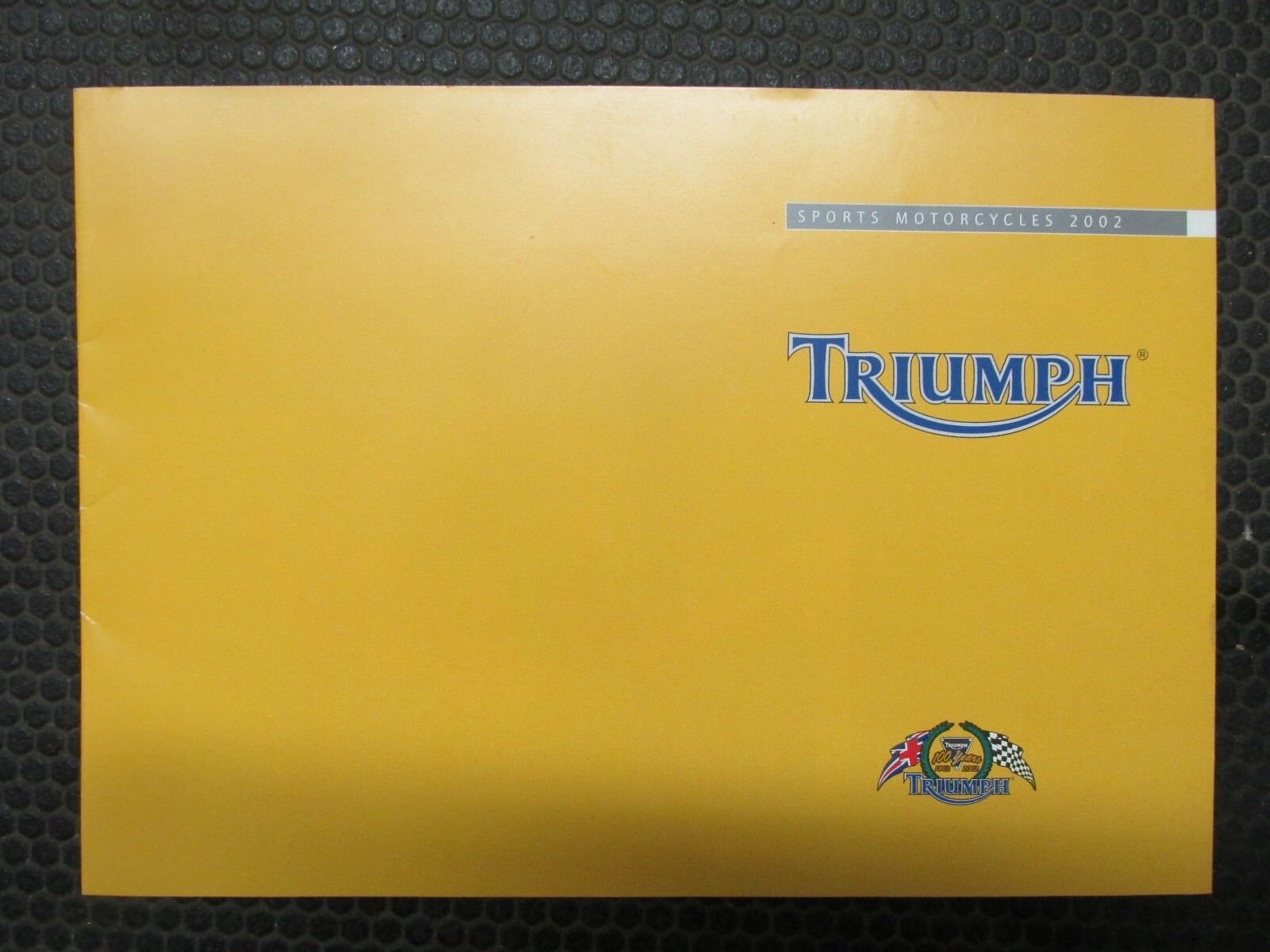 TRIUMPH MOTORCYCLE SALES BROCHURE  YEAR 2003  WITH POSTER OF TT600 IN ACTION