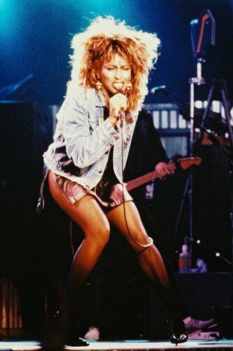 Tina Turner 24x36 Poster iconic in denim jacket and short skirt in concert