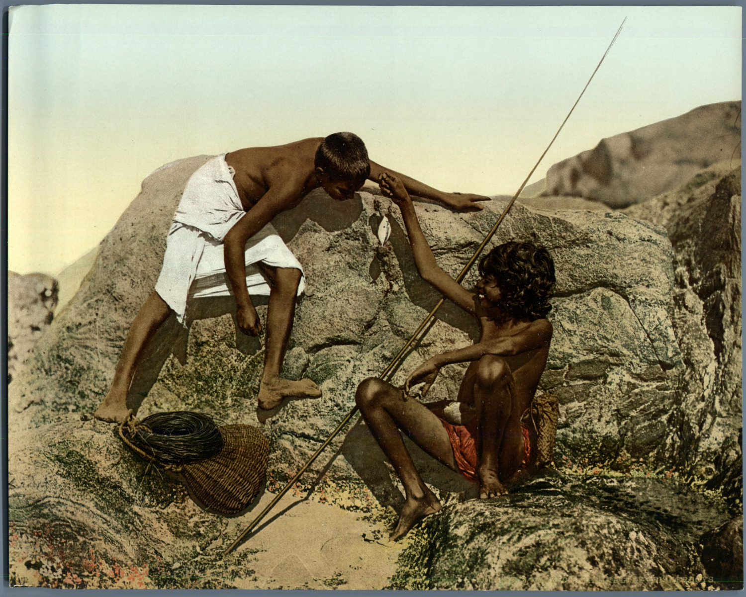 Ceylon. Singlalee boy showing to another one a fish he just caught. Vintage PZ 