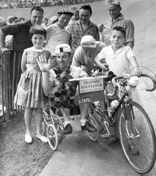 Irish racing cyclist Seamus \'Shay\' Elliott takes ride pram after arr- Old Photo