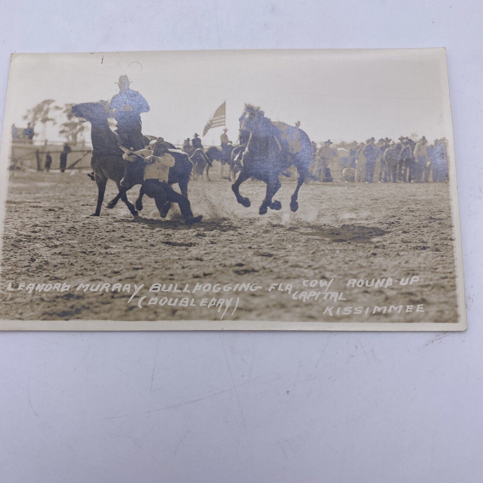 ANTIQUE REAL PHOTO POSTCARD COWBOY WESTERN RODEO LEANORD MURRAY BULLDOGGING