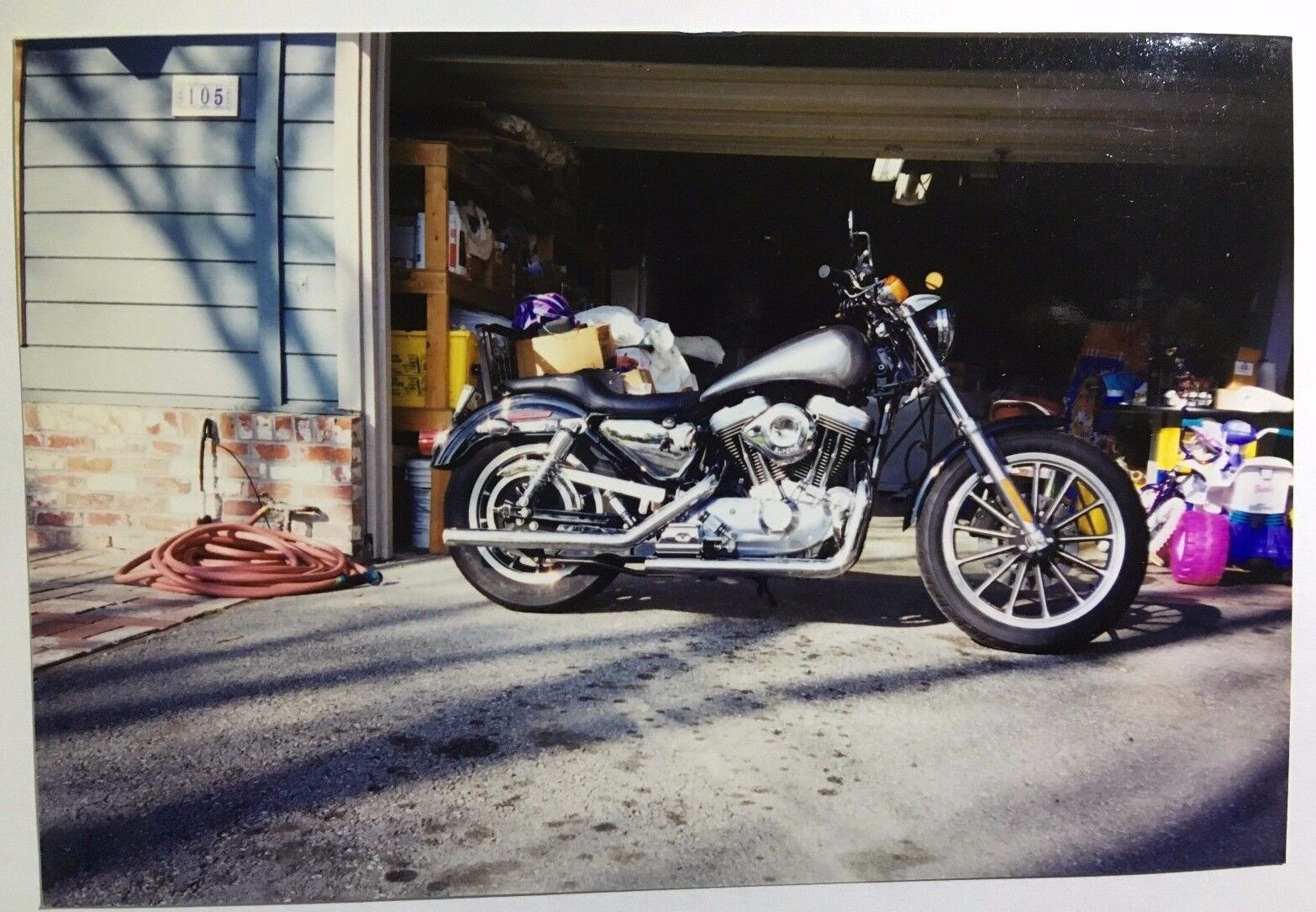 Vintage PHOTO Of A Custom Harley Davidson Motorcycle In Front Of Garage Door