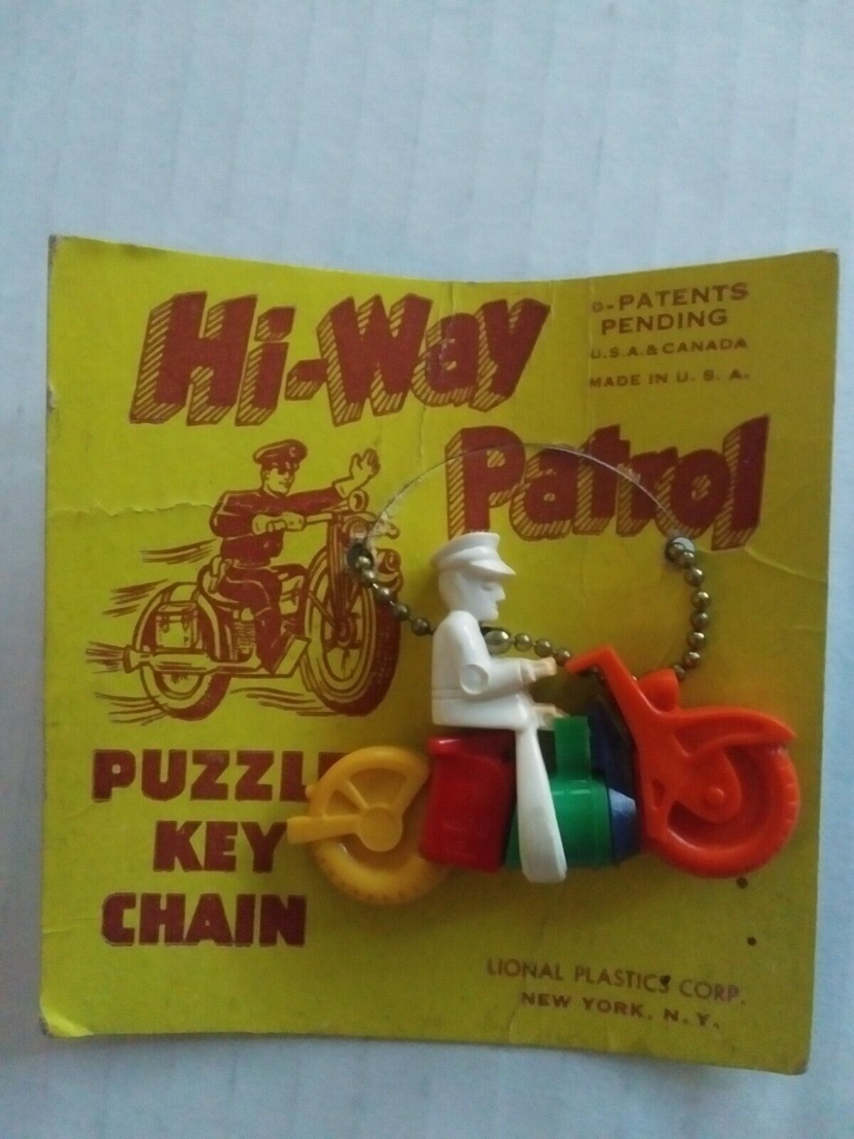 Vintage Hi-way Patrol Motorcycle Keychain Puzzle On Card