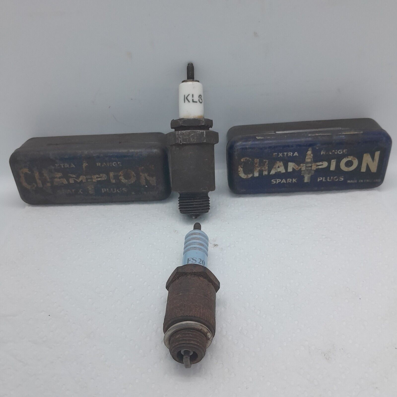 Vintage Champion Spark Plug Tins And Two Vintage Klg Spark Plugs.