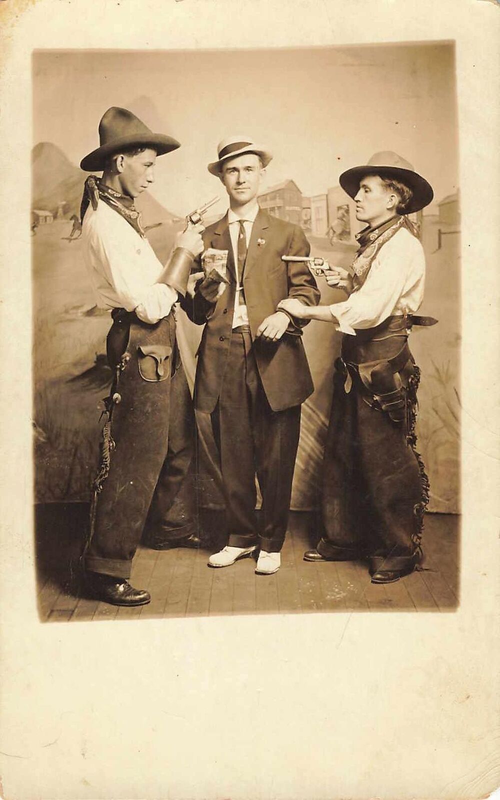 1910s Western Studio Photo Duel Cowboys Newsie? Odd Real Photo Postcard Gun rare