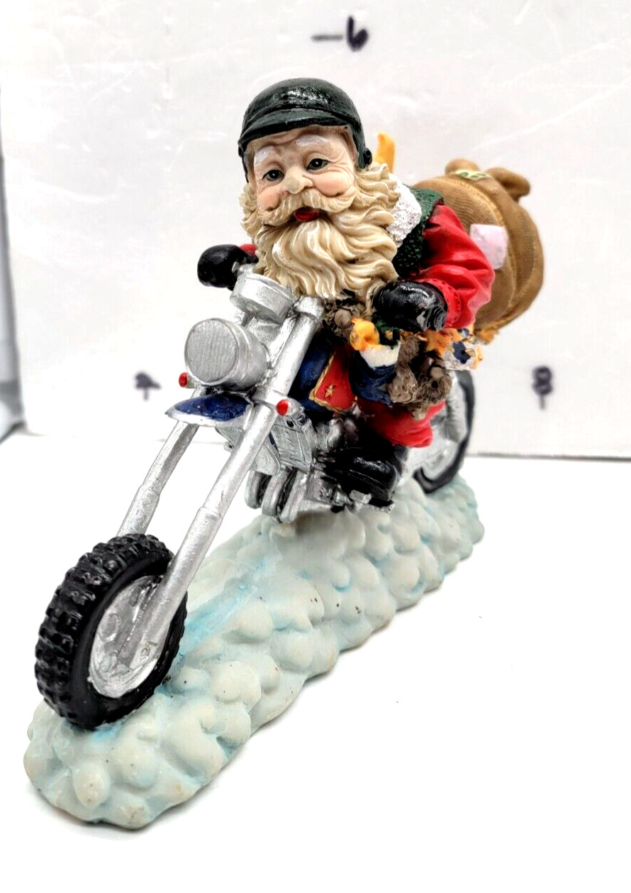 Christmas PolyResin Biker Santa Claus Figurine 7x5. Going Skiing