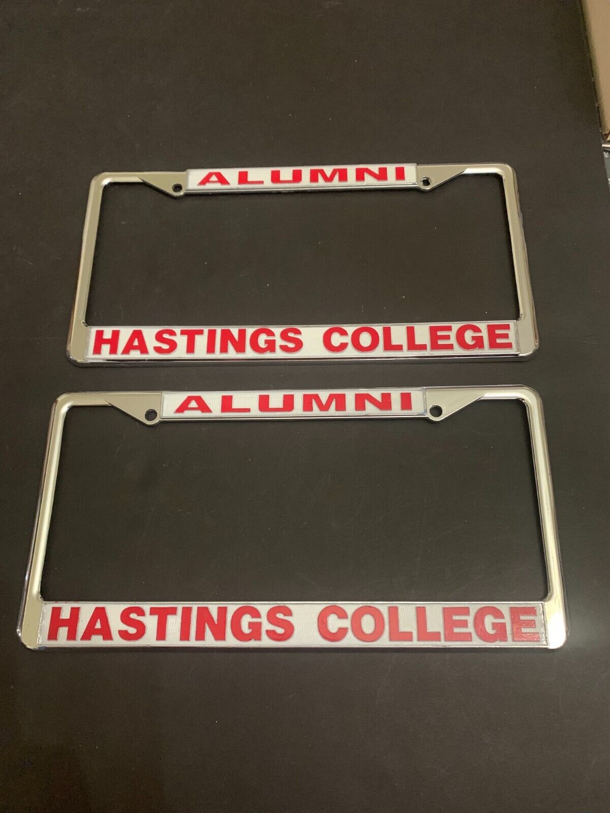 Vintage Pair of Hastings College Alumni Metal License Plate Frame
