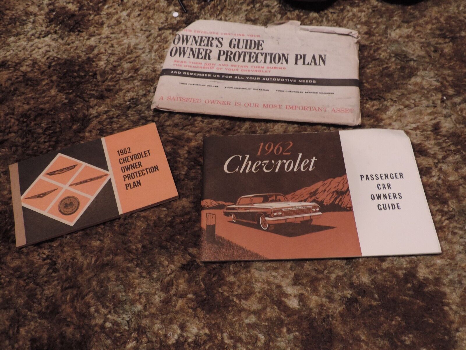 1962 Chevy Owners Guide (1st ed),Protection plan (2nd ed) & paper holder