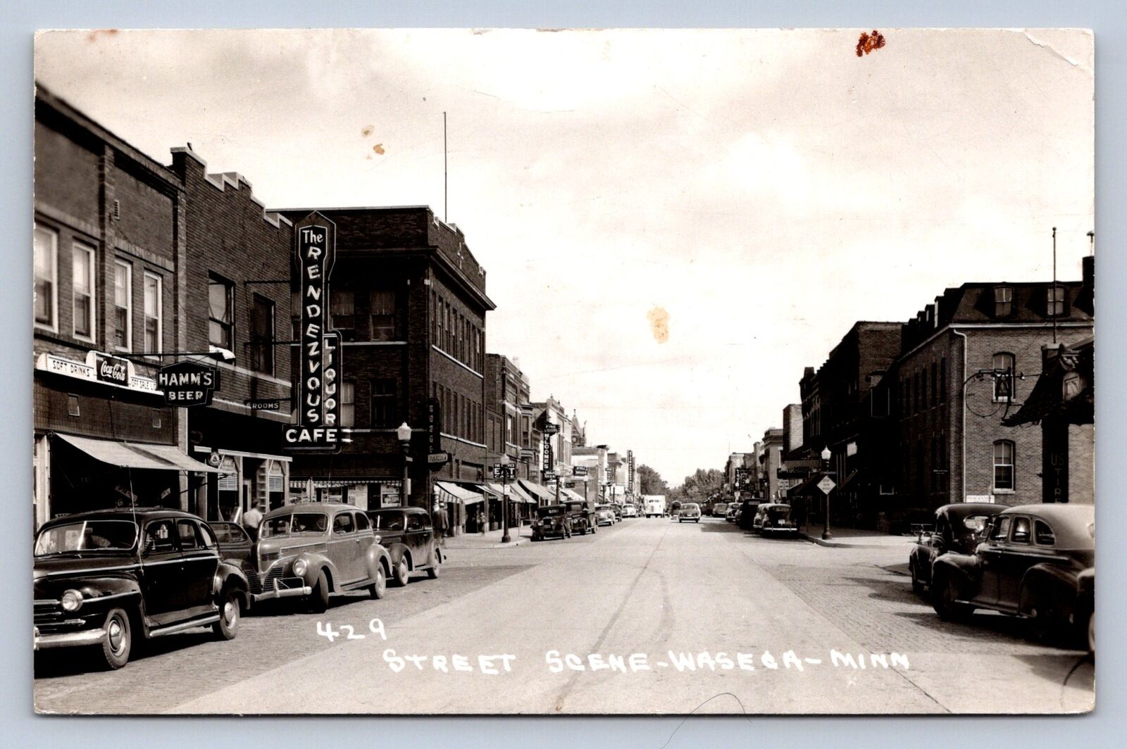 J90/ Waseca Minnesota RPPC Postcard c40-50s Main Street Stores 580