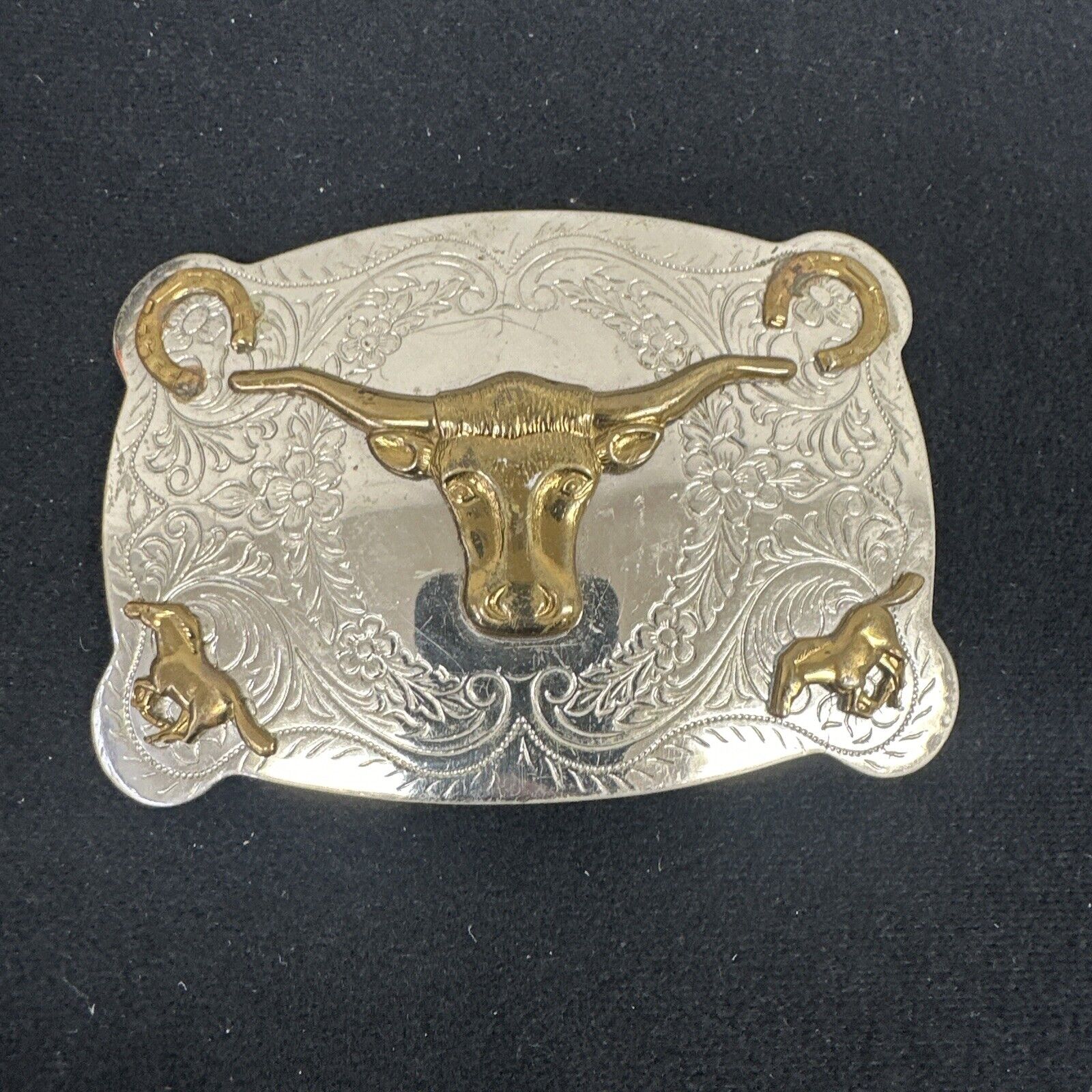 The Longhorn cow steer  western belt buckle with Lucky horseshoe accents 1960s