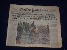 2001 SEPTEMBER 13 THE NEW YORK TIMES-STUNNED RESCUERS COMB ATTACK SITES- NP 3027 picture