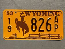 VINTAGE 1983 WYOMING LICENSE PLATE BUCKING BRONCO /FENCE 19-826AP MINT🤠 picture