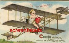 C1910 EMBOSSED Winsch Schmucker Valentine's Day Postcard CUPID FLYING BI-PLANE picture