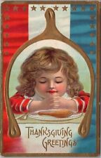 c1910s Patriotic THANKSGIVING Embossed Postcard Praying Girl at Dinner Table picture