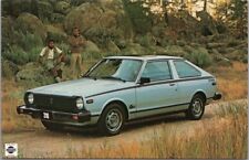 Vintage 1980 DATSUN 310 Automobile Advertising Postcard Two Macho Guys and Car picture