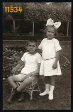 Vintage Photograph, sweet girl and boy in garden, big bow, by Feldmann 1920's picture