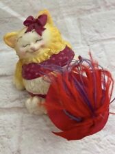 Red Hat Theme Smiling Kitten with Bow Playing with Red Feathered Hat Figurine picture