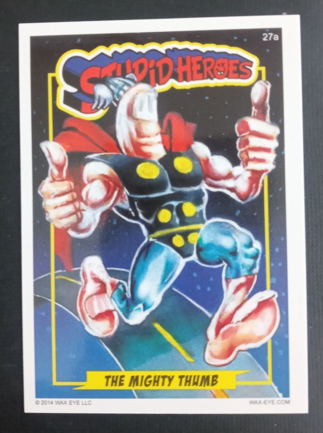 2014 Wax Eye Stupid Heroes Base Card The Mighty Thumb #27A