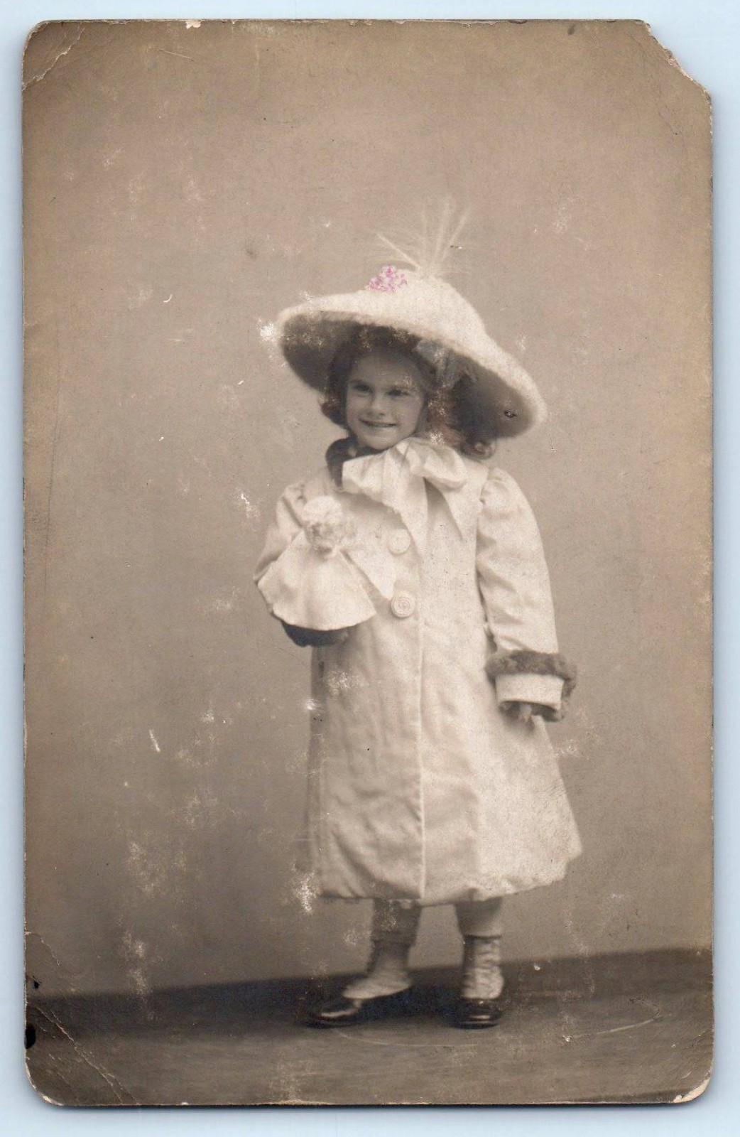 c1910's Smiling Child Girl With Doll Big Hat Studio RPPC Photo Antique Postcard