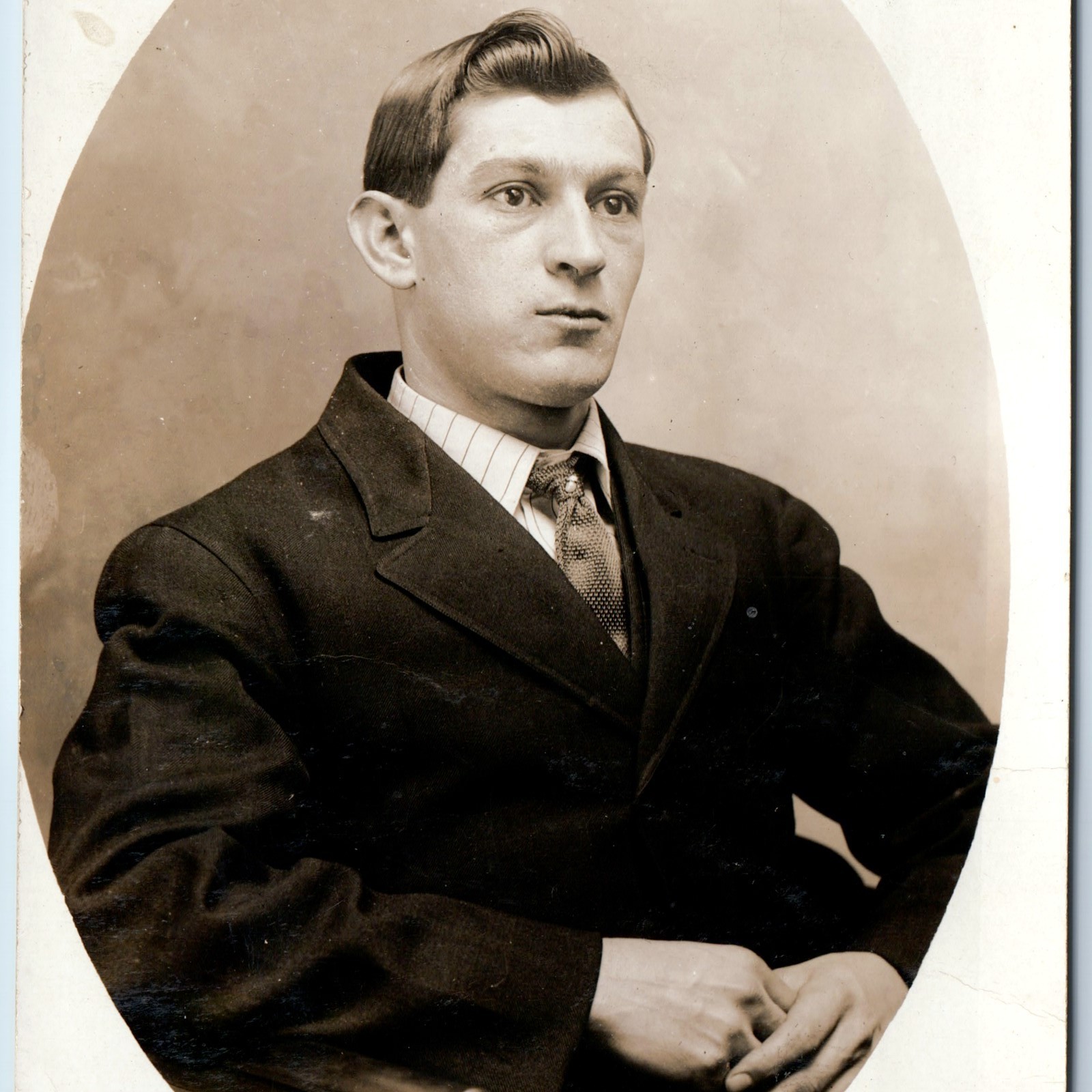 c1910s Young Handsome Man Studio Portrait RPPC Postcard Oval Vignette Suit Tie