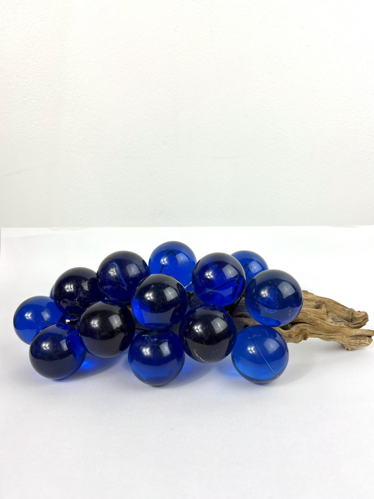 Vintage Lucite acrylic grape cluster features royal blue grapes on Wood Stem