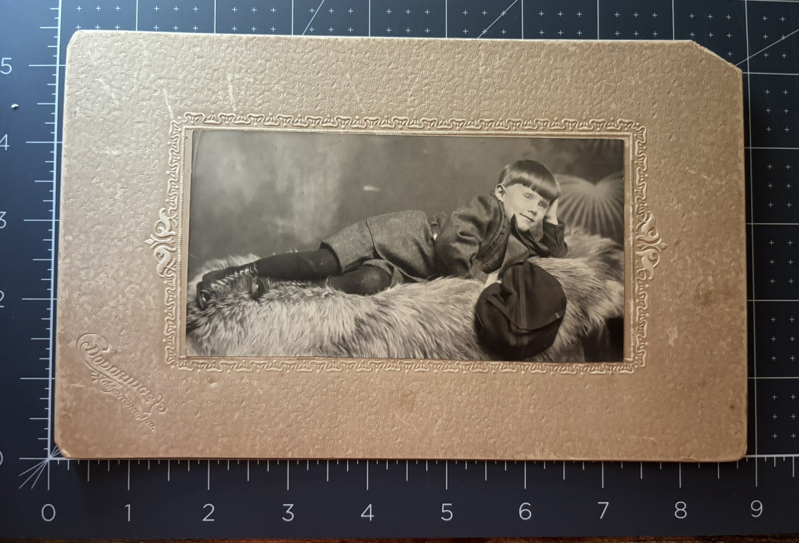 Late 19th Early 20th Century Photograph of Boy posing on Ornate Couch