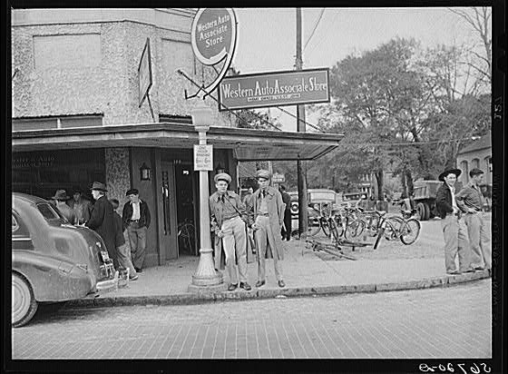 Photo:Starke Florida 1940s Soldiers Street Corner Western Auto bikes