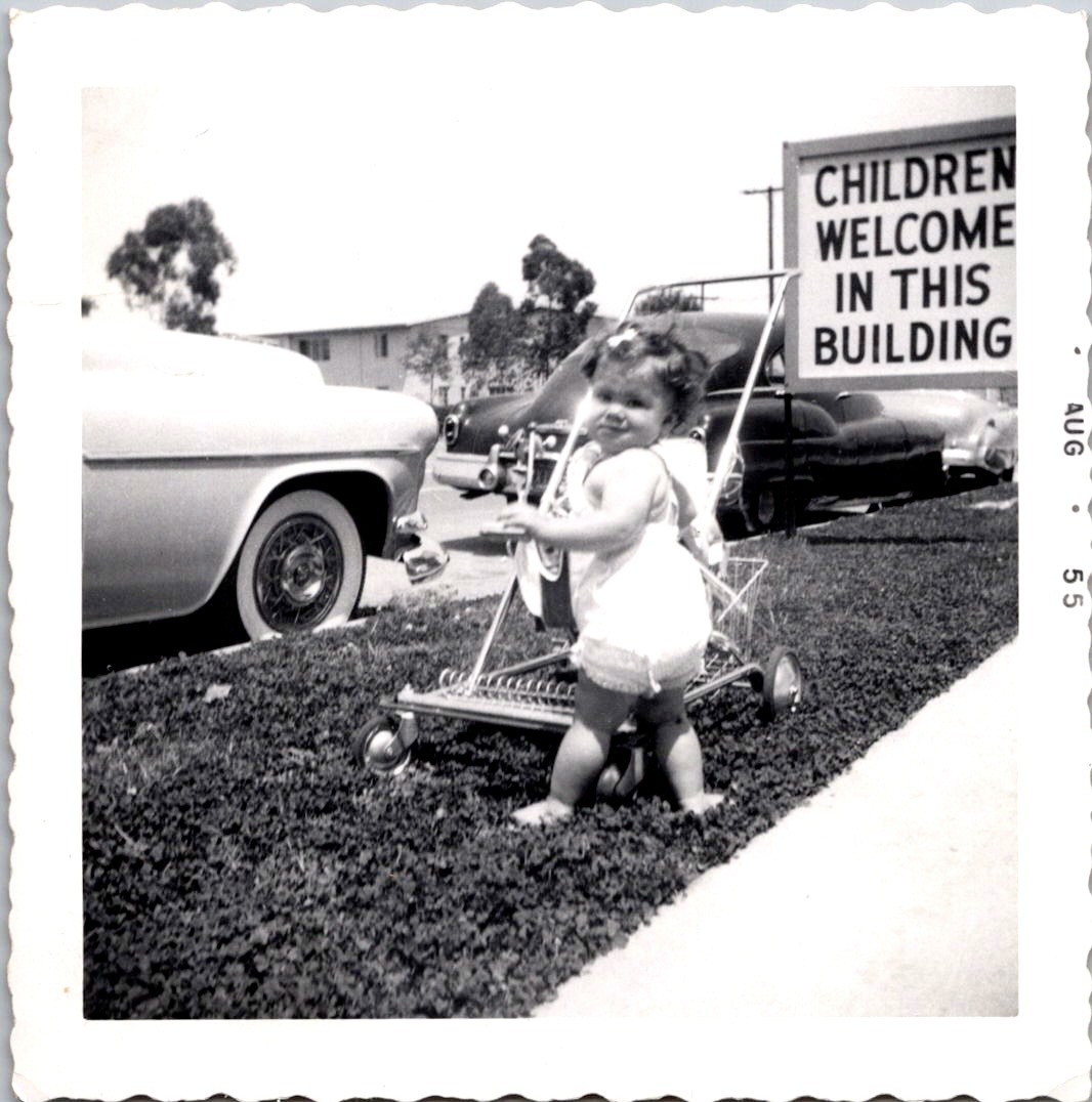 Cute Toddler Girl with Stroller Outside, 1955 B&W Snapshot Photo