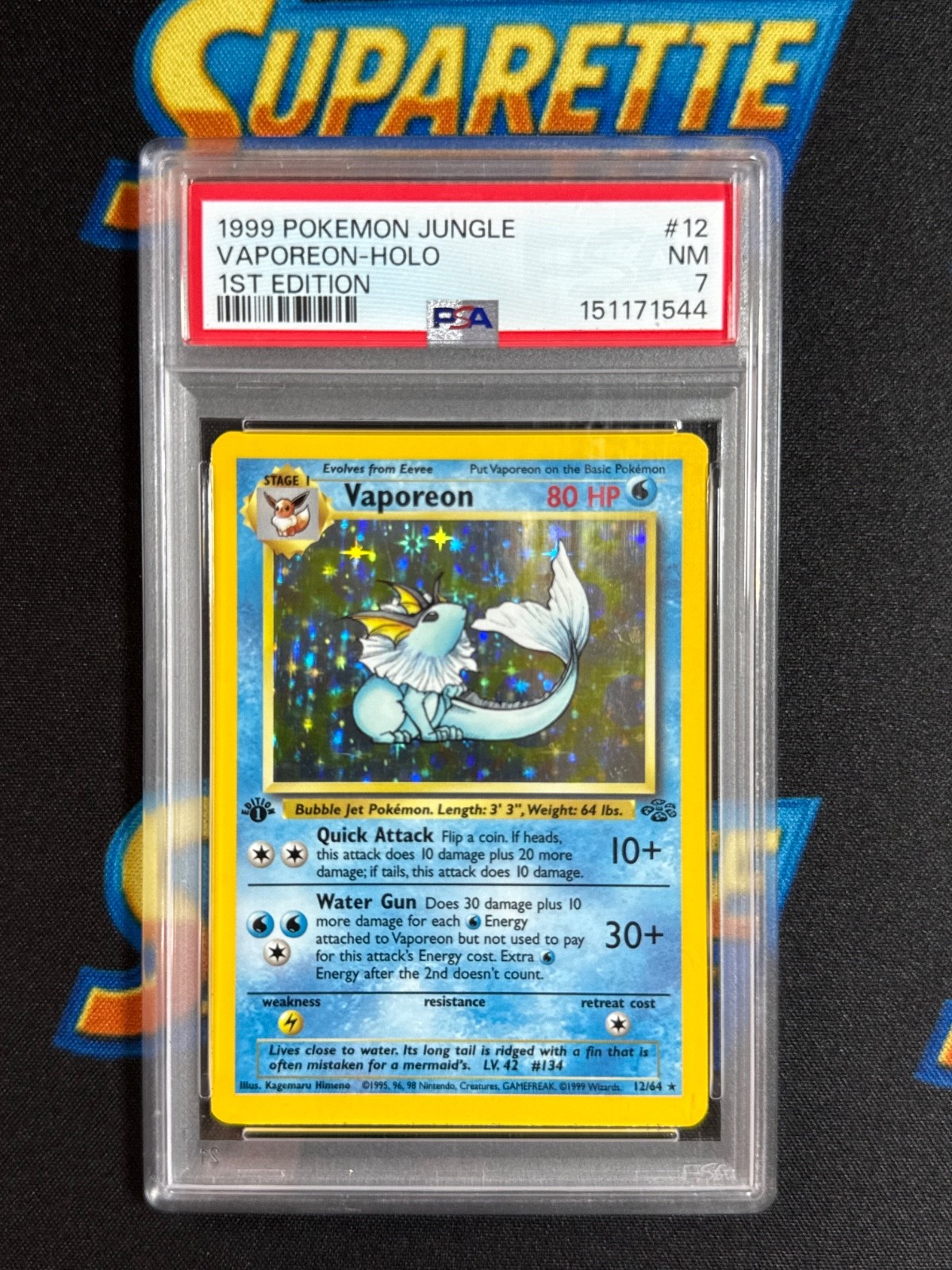 1999 Pokemon Fossil 1st Edition Vaporeon Holo PSA 7 12/64
