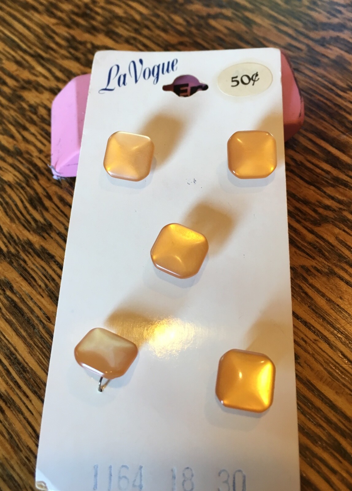 Vintage LaVogue buttons on a card, lt. rust/orange, square, 5/8\