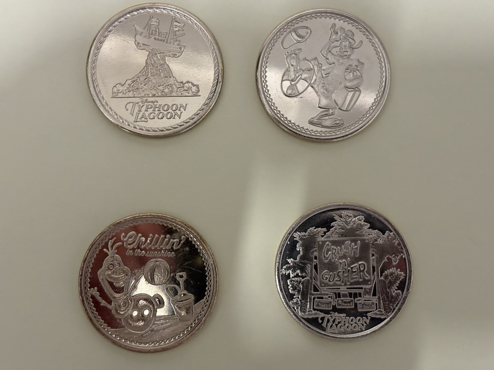Disney Parks Typhoon Lagoon Medallions Set Of 4 Goofy Olaf Crush N Gusher 6