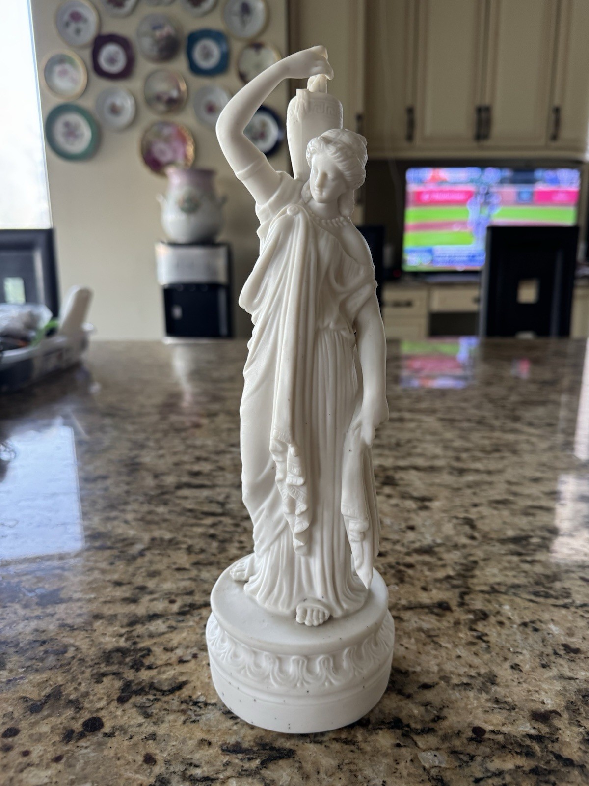 Antique bisque porcelain statue is likely a piece of 19th-century Parian ware
