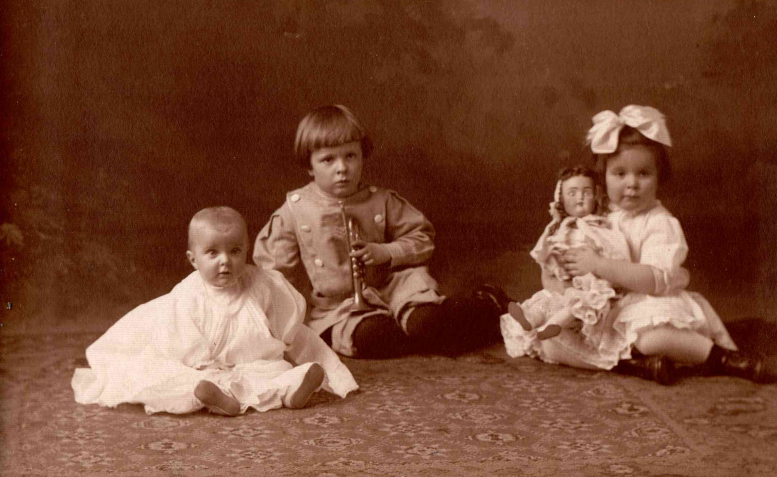 RPPC- Three little Children - one with a Doll - Cutest Faces - c1920