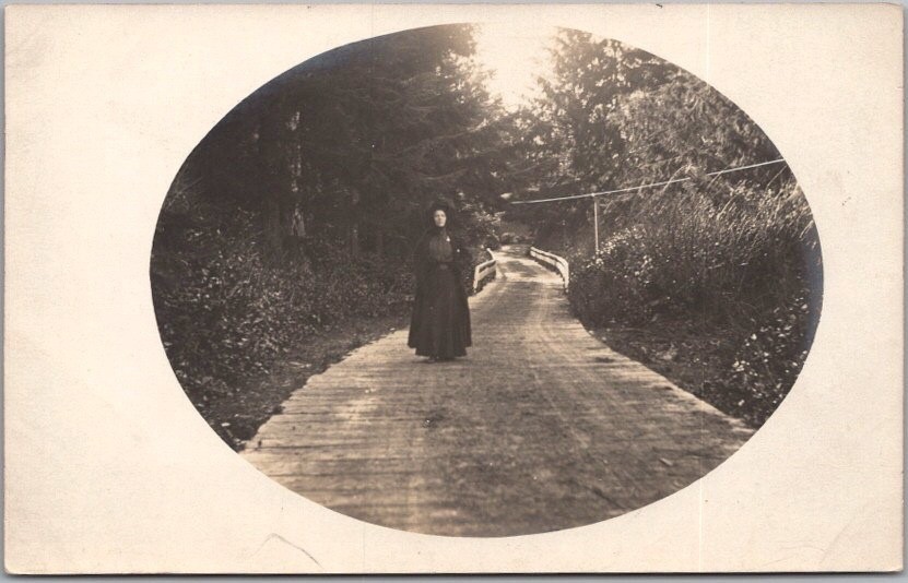 Vintage 1910s Real Photo RPPC Postcard / Woman in Black Dress Walking in Road