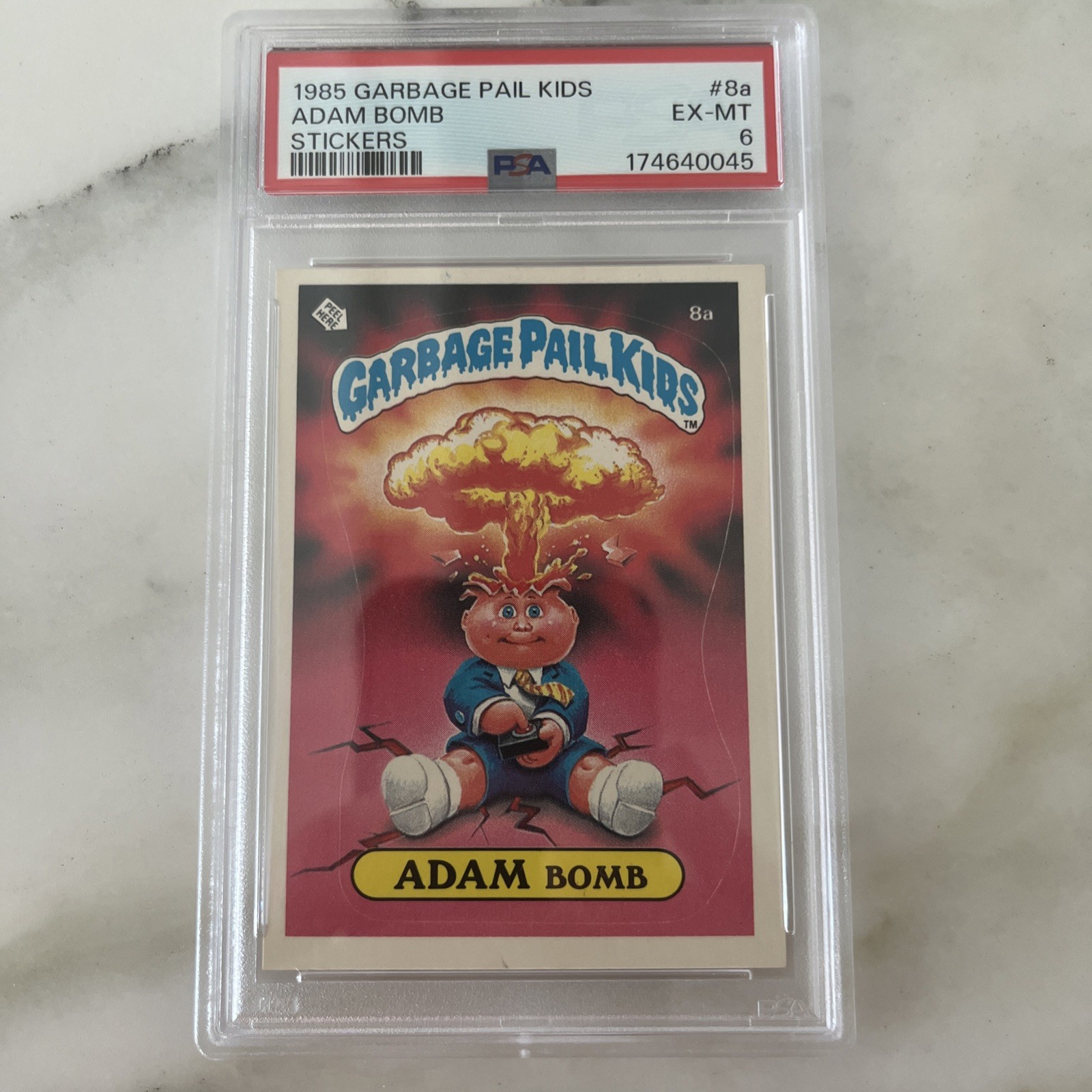 Topps 1985 Garbage Pail Kids Stickers #8a Adam Bomb Sticker PSA 6 Topps 1985 Garbage Pail Kids Stickers #8a Adam Bomb Sticker PSA 6