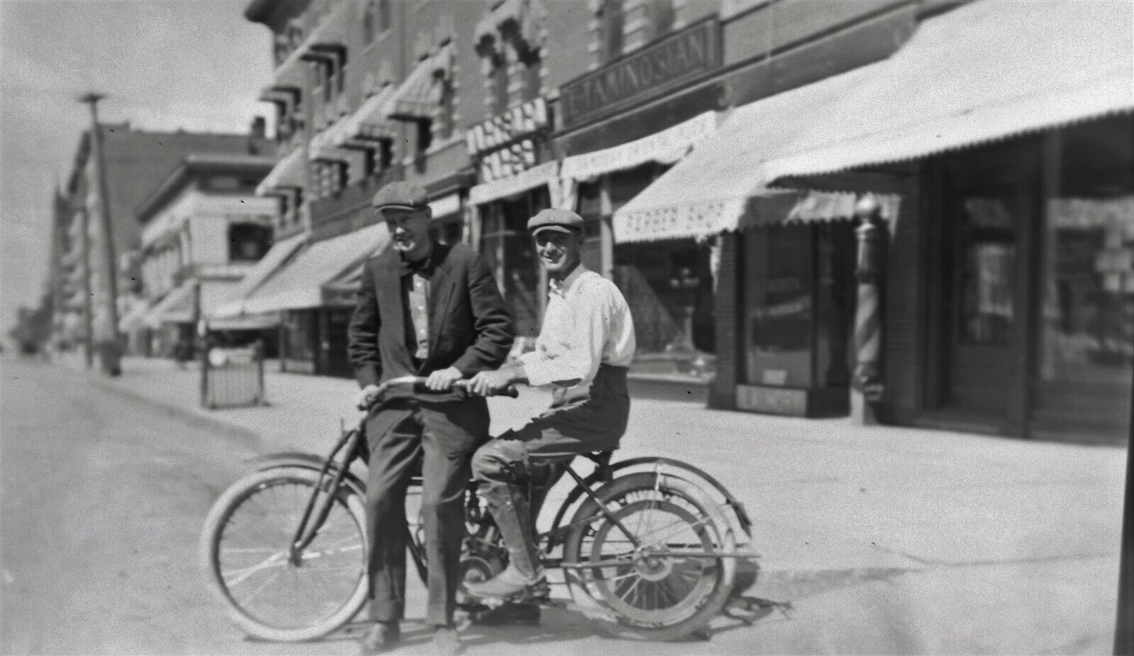 Early original negative of a 2 guys on a MERKEL LIGHT motorcycle - street scene