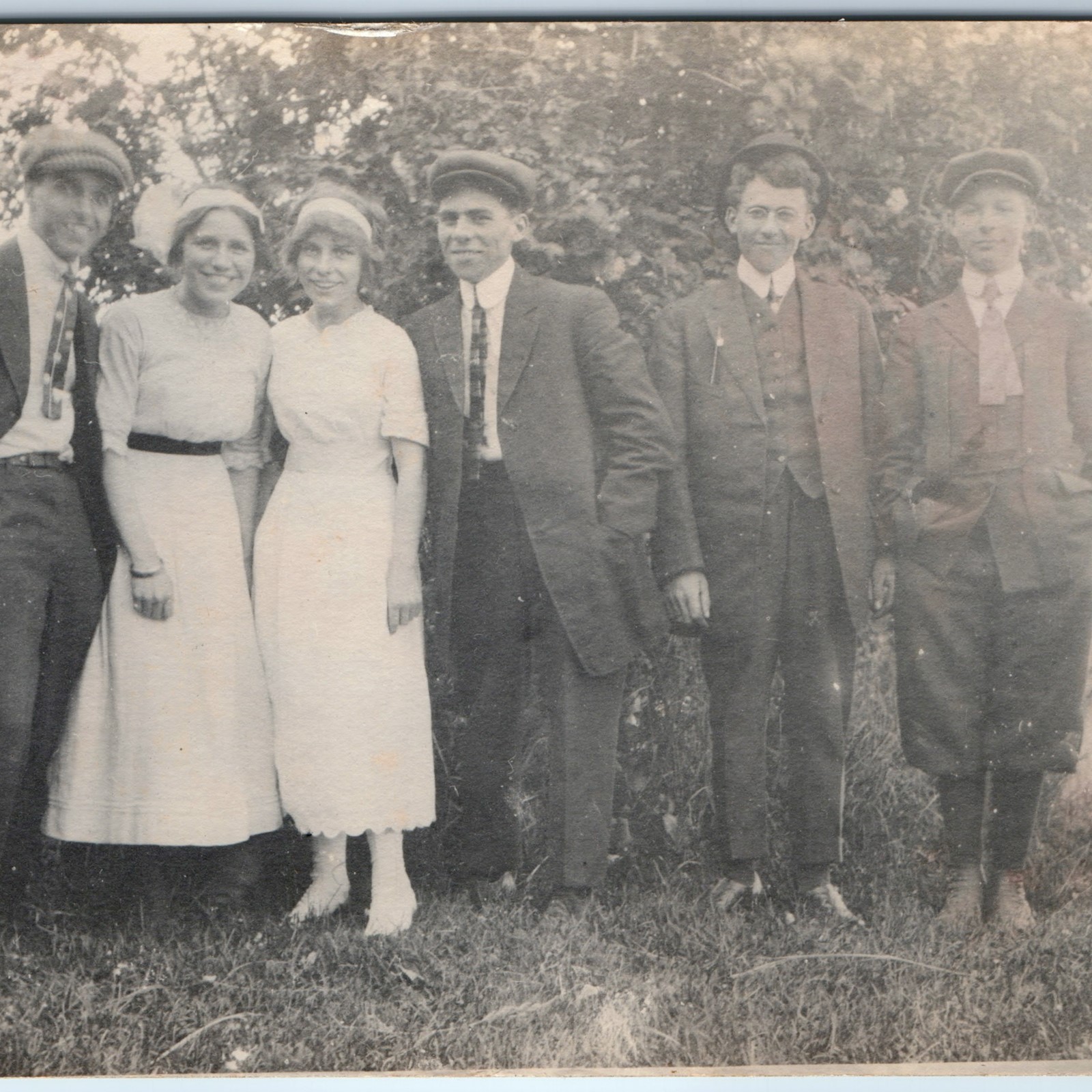 c1910s Young Men Women Group Outdoors RPPC Fashion Flat Cap Dress Photo Postcard