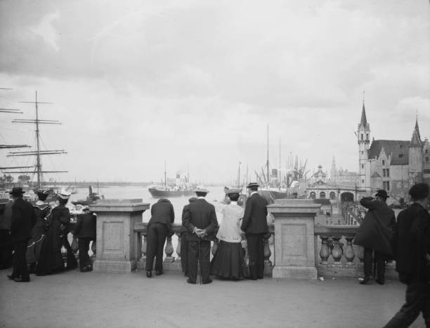 Travel views of Europe 1900s Group of people watching ships in a p- Old Photo