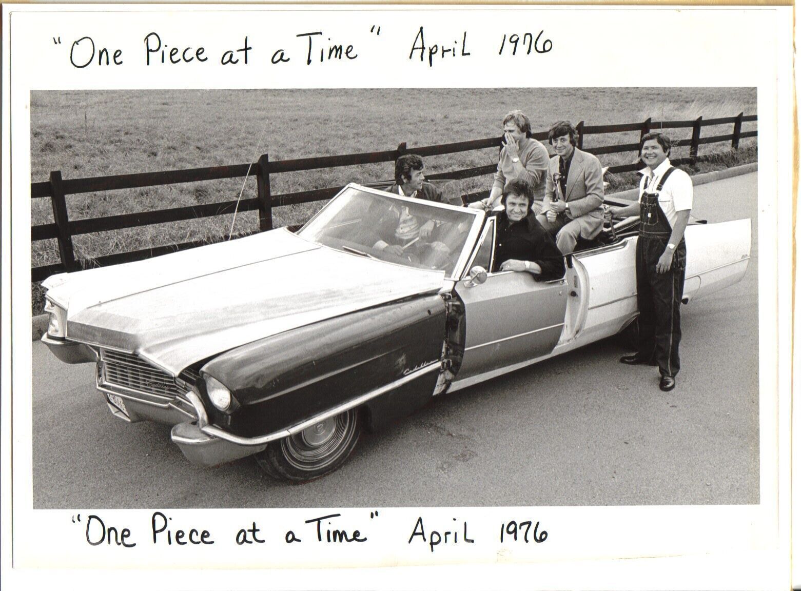 Johnny Cash poses at wheel of his One Piece At A Time Cadillac 8x10 inch photo