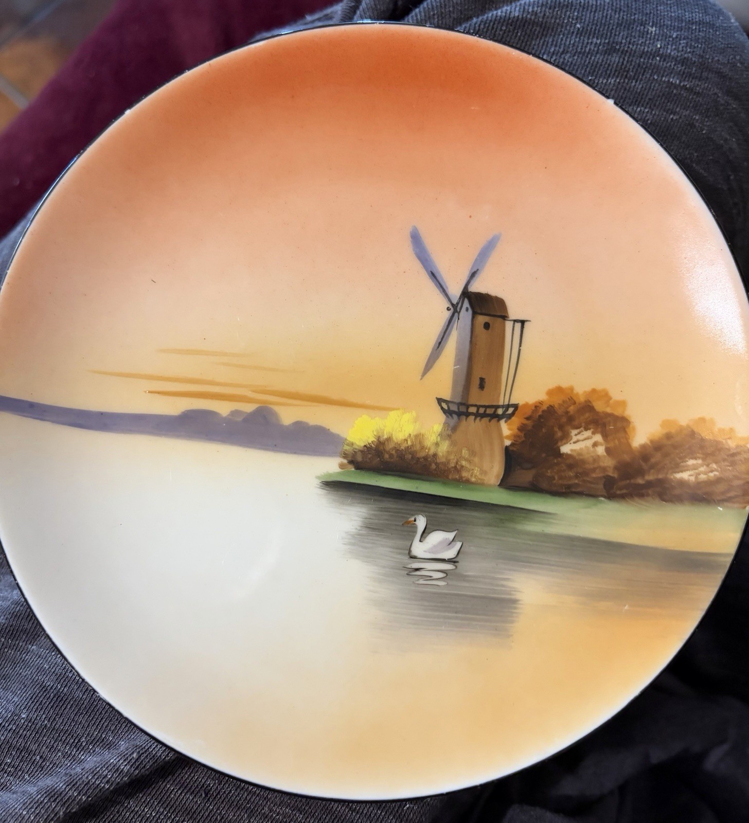 This vintage hand-painted porcelain plate was produced by Noritake (Morimura Bro