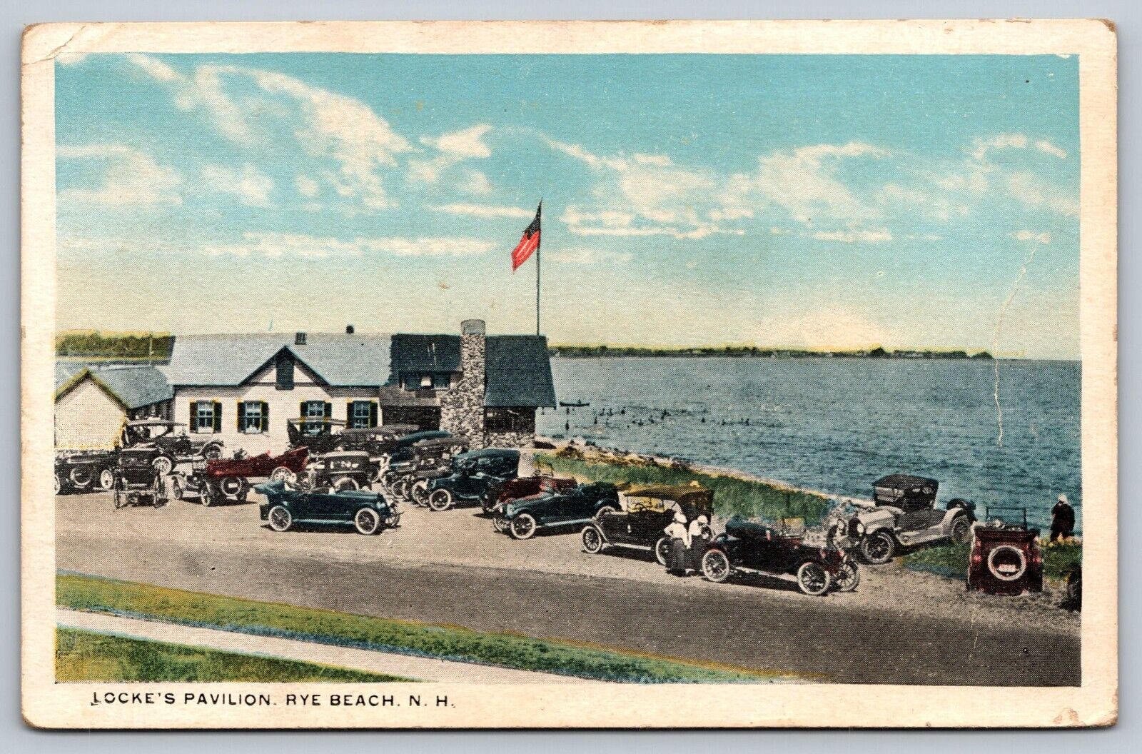 c1920's The Pavilion Building Classic Cars Dirt Road Flag Rye Beach NH Postcard