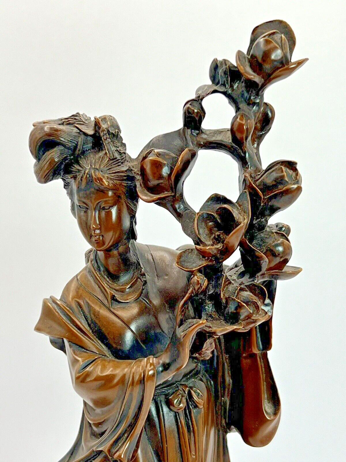 Asian Figurine with Lotus Flower Bundle