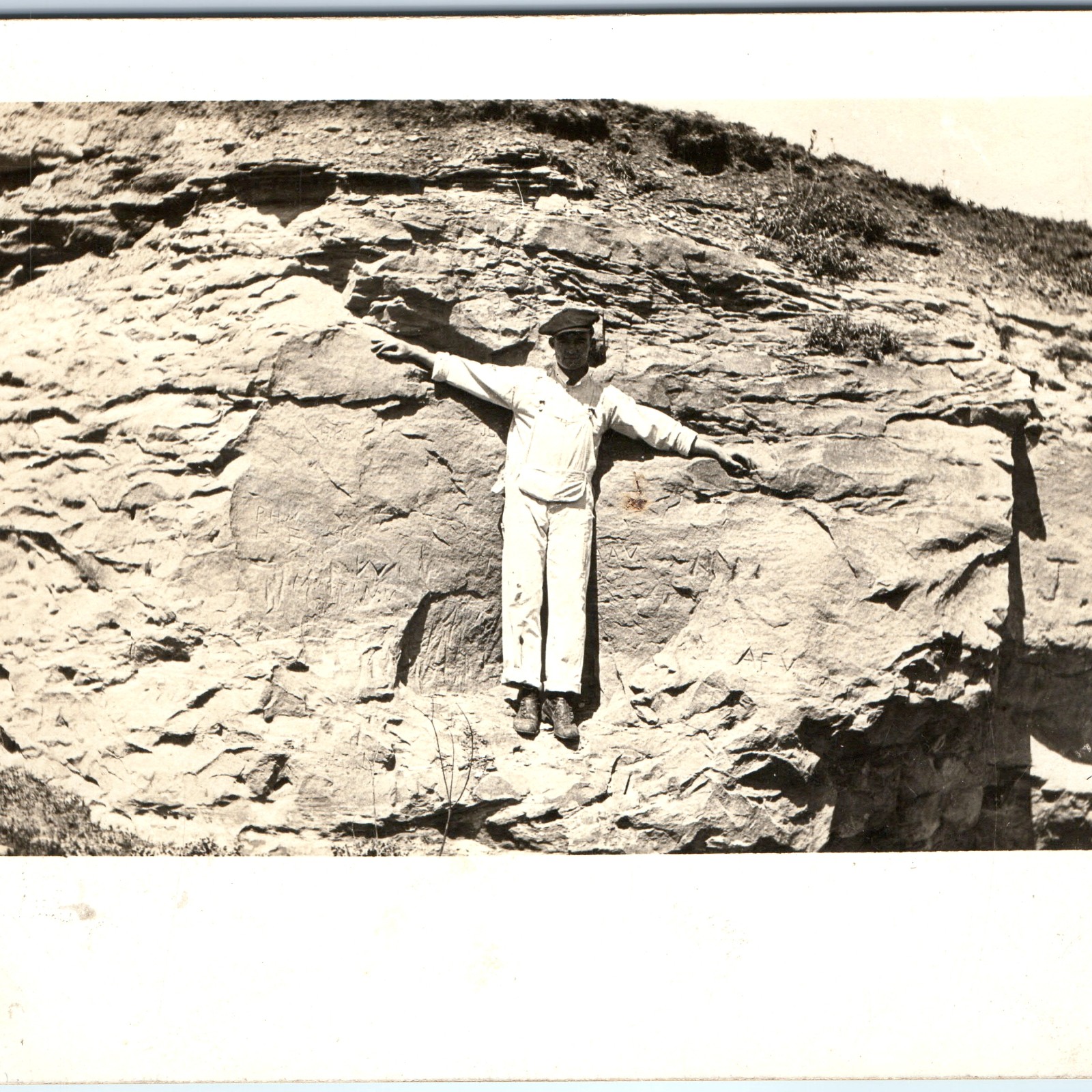 c1910s Man in White Overalls RPPC Postcard Carved Initials Rock Cliff PH AFV JM