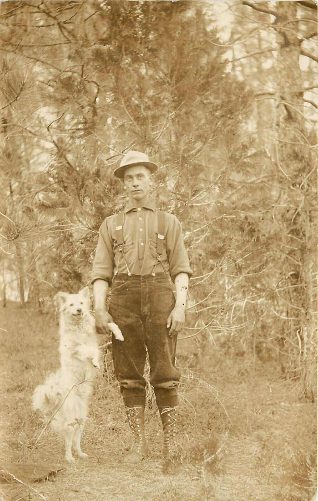 c1910 RPPC; Portrait of Harry Phillips Holding Paw of White Dog Standing Up