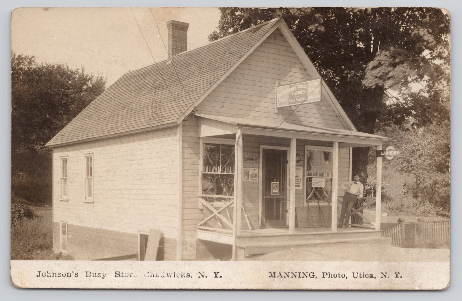 RPPC Johnson's Busy Store Chadwicks NY Moxie - Fireworks - Laundry Sign PM1910