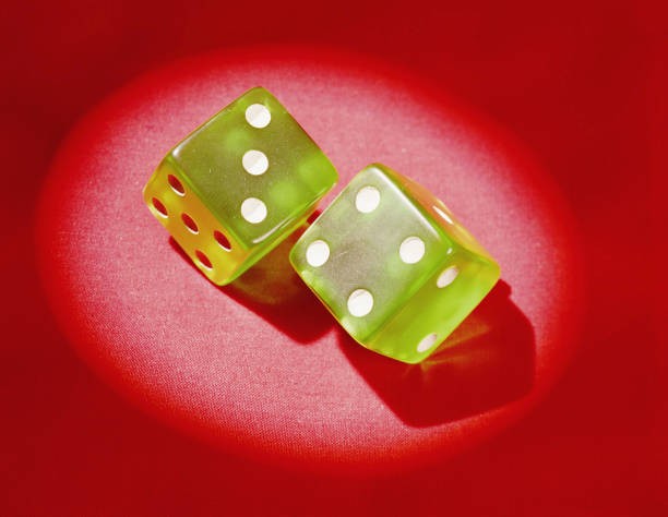 1960s Pair of green plastic dice showing lucky 7\' Historic Old Photo