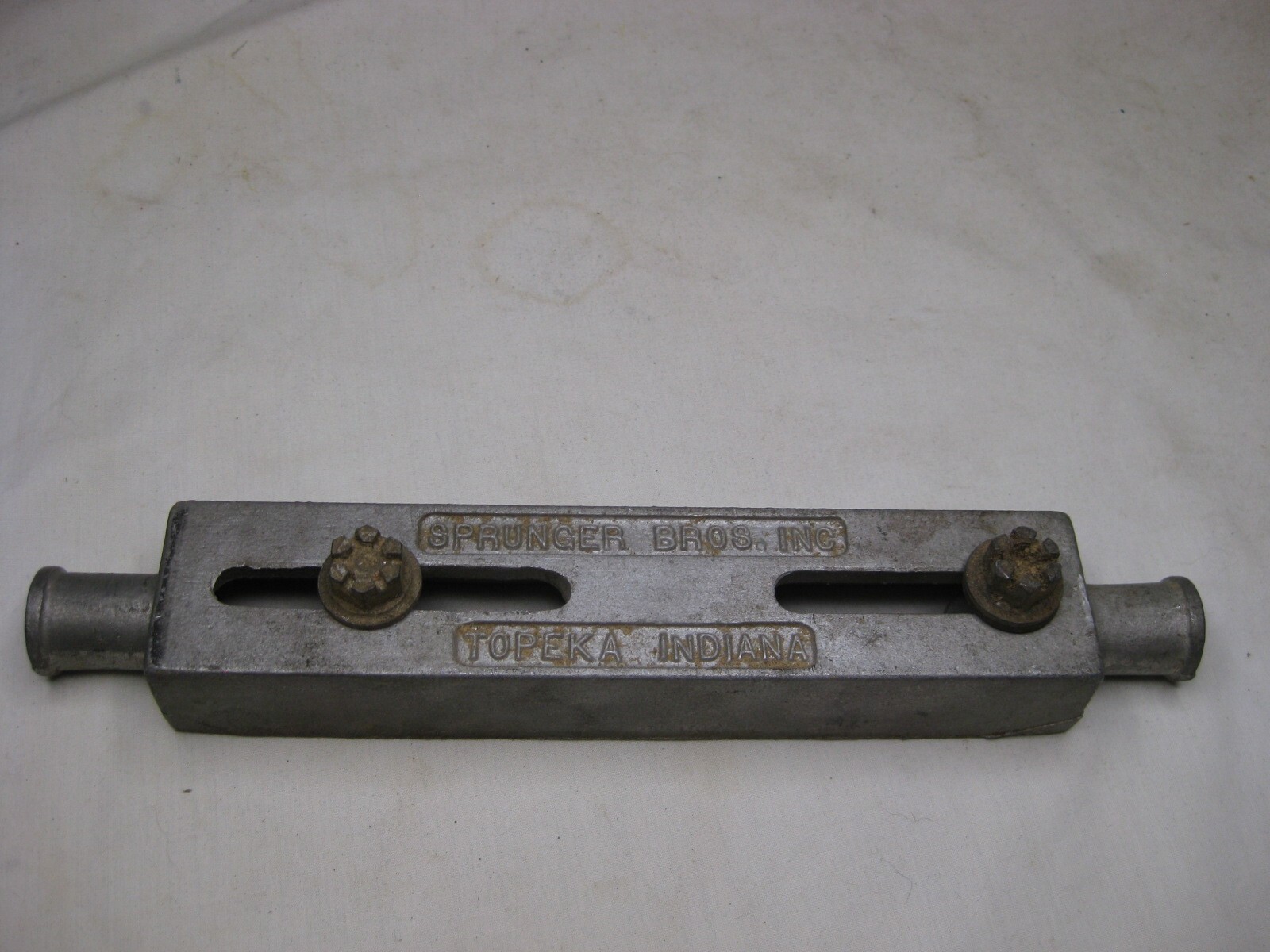 vintage SPRUNGER BROS. INC TOPEKA INDIANA metal marked 21-102 band saw part ?