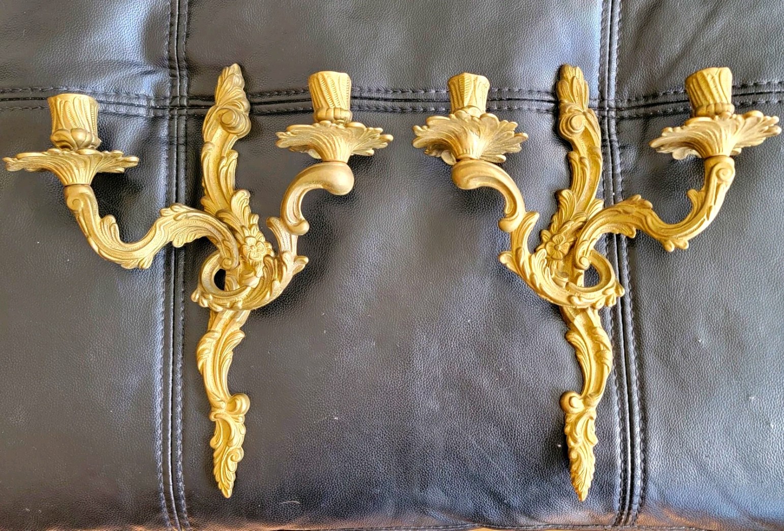 A pair of Louis XV-style or Rococo-inspired wall-mounted candle sconces