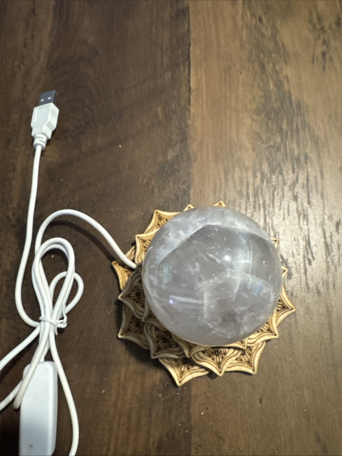 Quartz Crystal Sphere On Color Changing Stand  339 Grams 2.5”