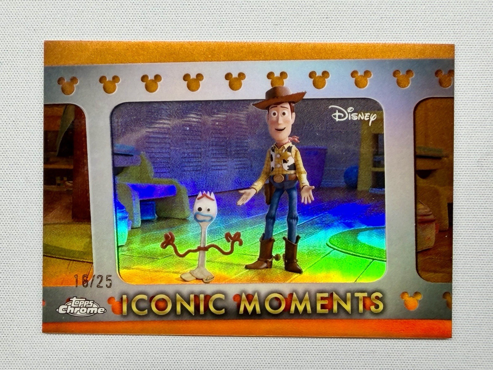 2025 Topps Chrome Disney Woody - Icomic Moments Orange /25